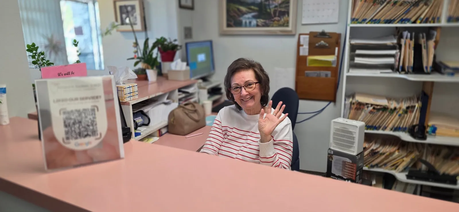 A friendly face at the HB Dentist front desk