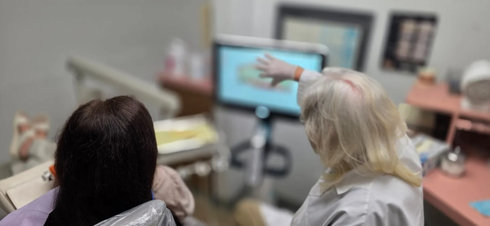 Reviewing dental images and treatment options at HB Dentist